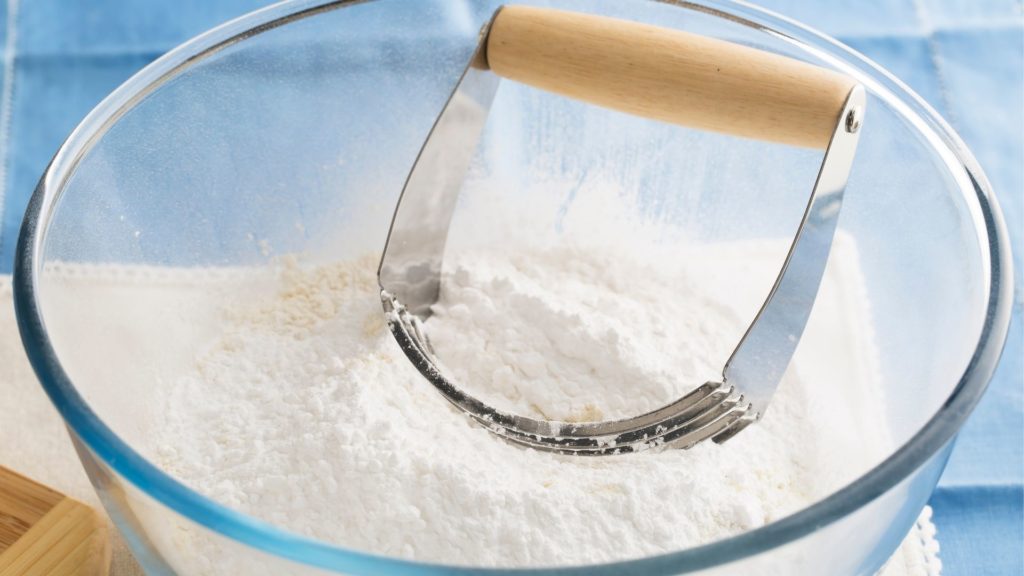 A Pastry Cutter In a bowl with flour